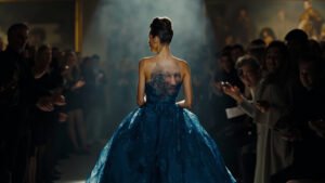 Cate Blanchett, Glenn Close, and Richard Gere applauding during Giorgio Armani's final Milan Fashion Week show as a model in blue gown bows on runway